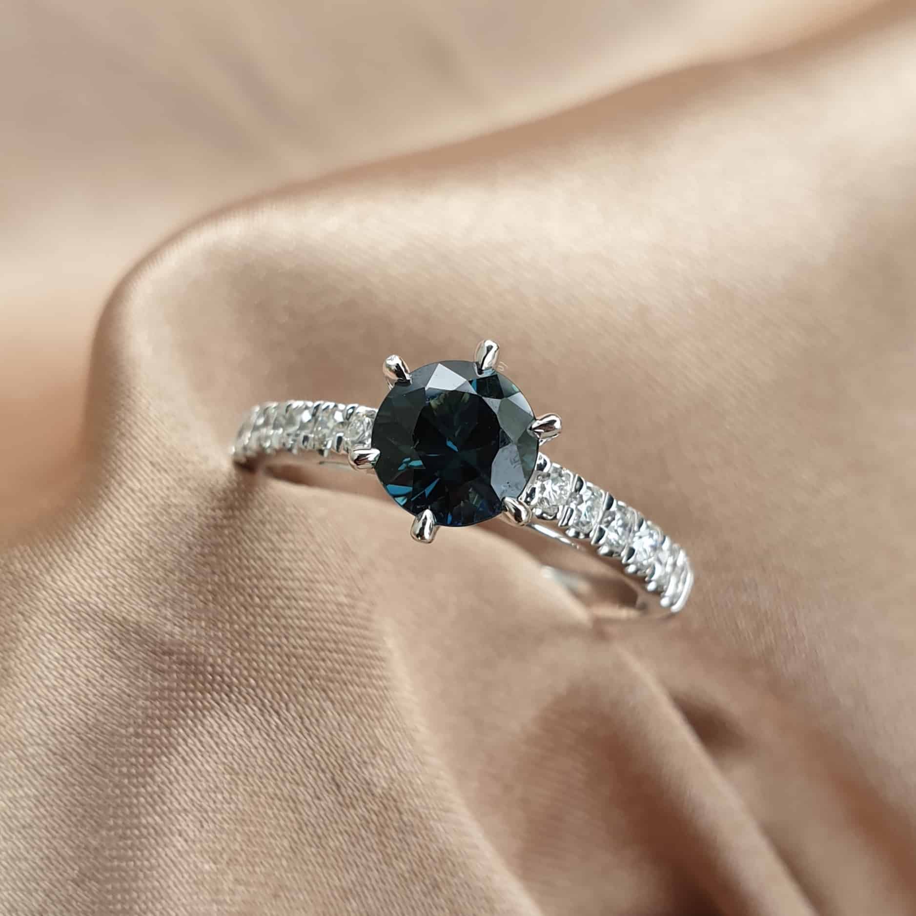 Round sapphire & diamond ring
